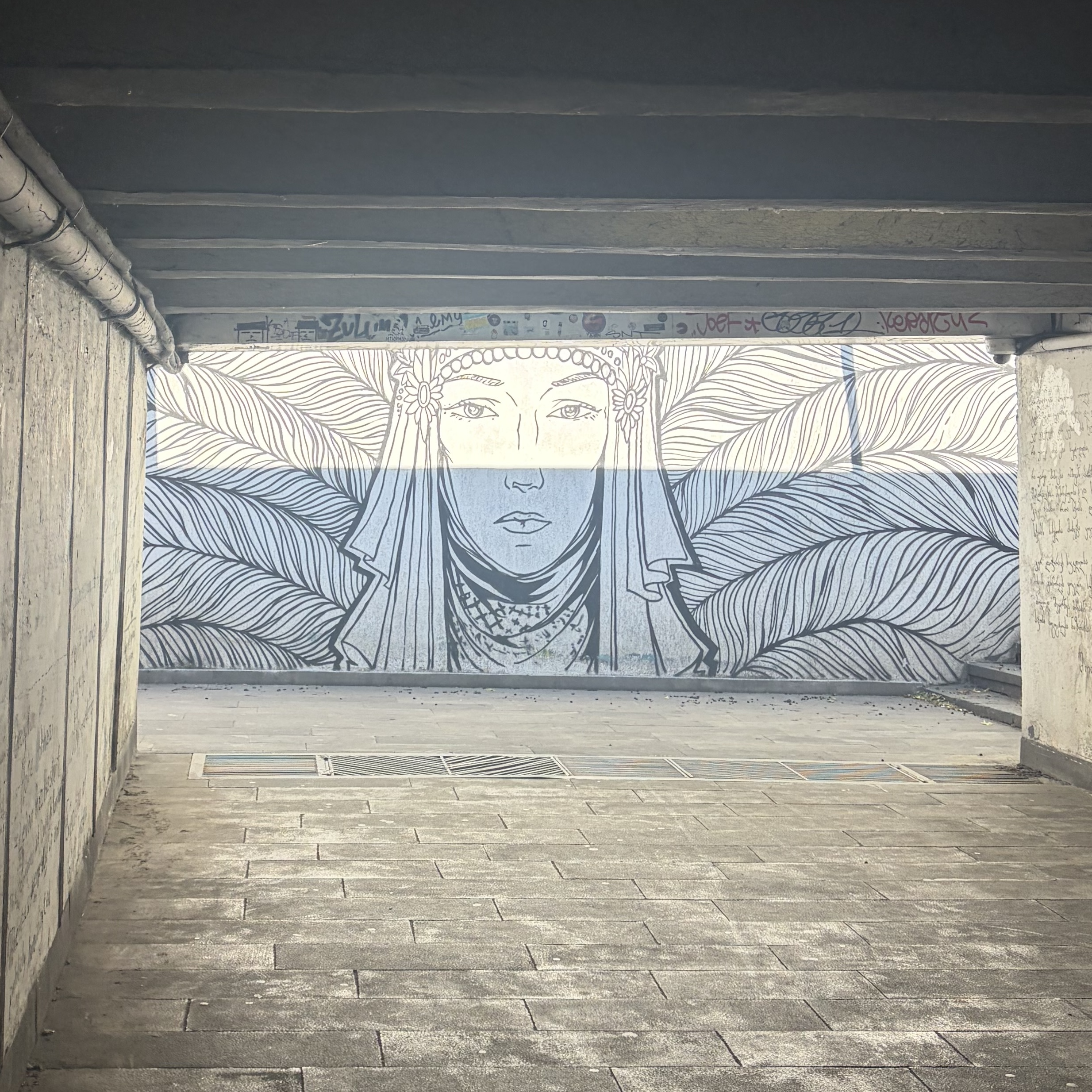 Graffiti art in crossing tunnel near Avlabari Justice House Tbilisi